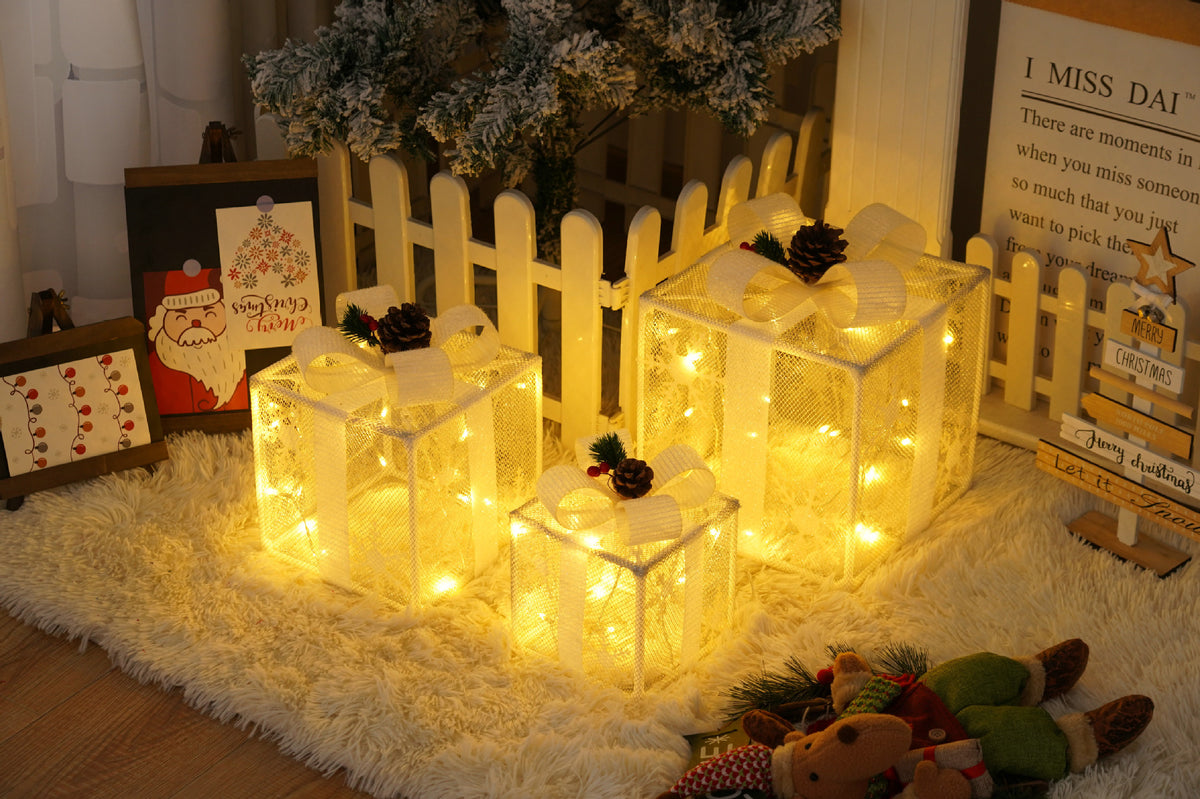 Set of three light up Christmas gift boxes, shown unlit