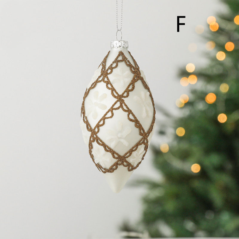 Six glass Christmas ornament options in champagne and white finishes