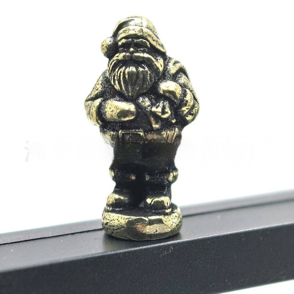 Metal gnome Christmas tree ornament with a hinge at the middle
