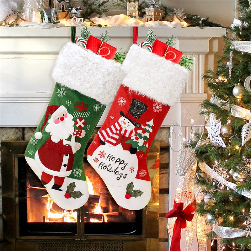 Red and green flannel Christmas stocking with a Santa design
