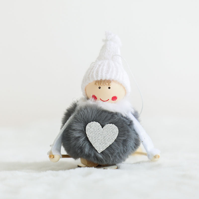Soft plush pile and the stitched hanging loop of the pendant