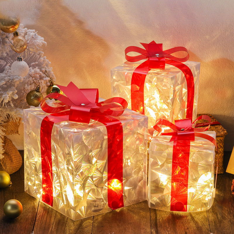 Red light up Christmas gift boxes grouped at different heights
