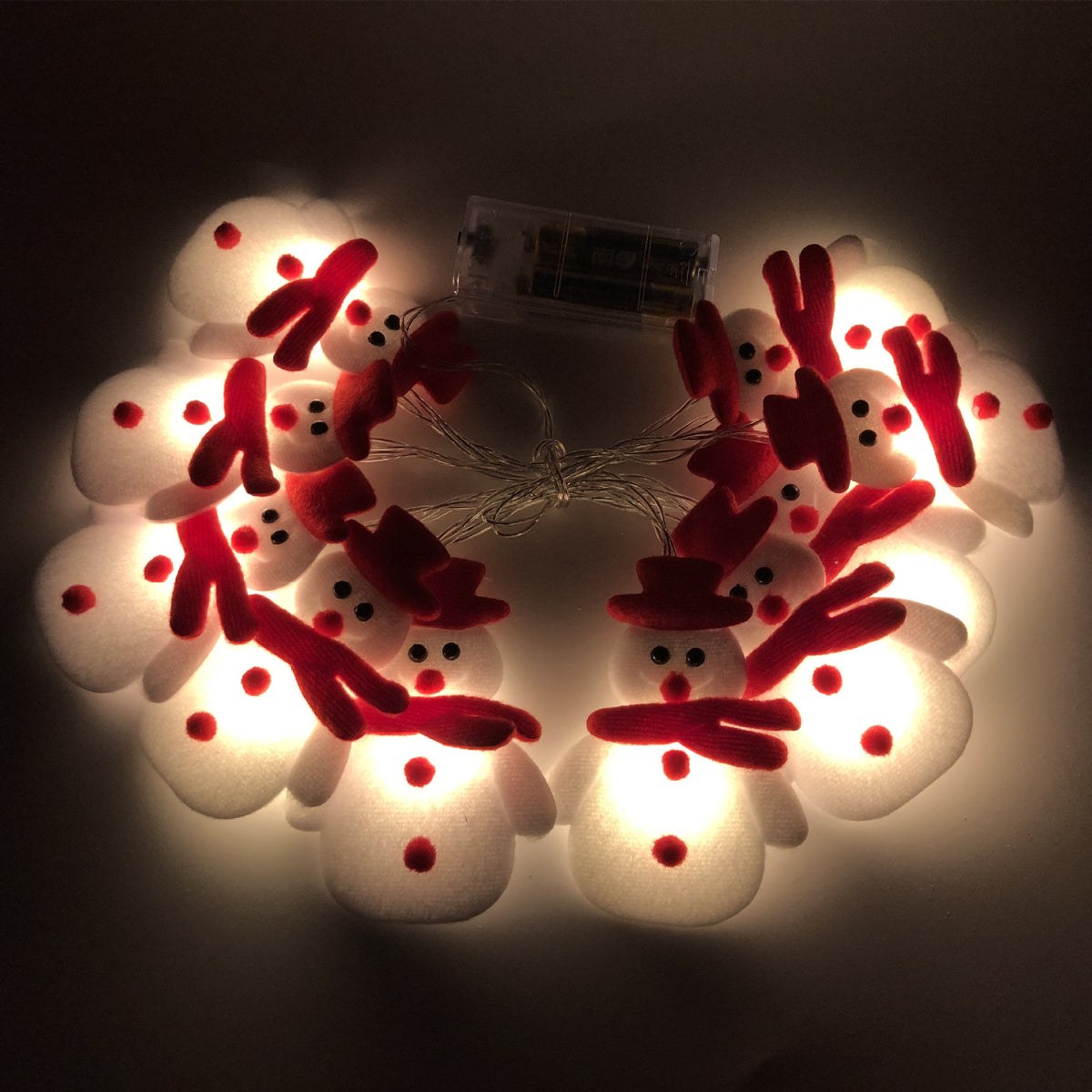 Plush snowman Christmas string lights with warm white LEDs along the strand