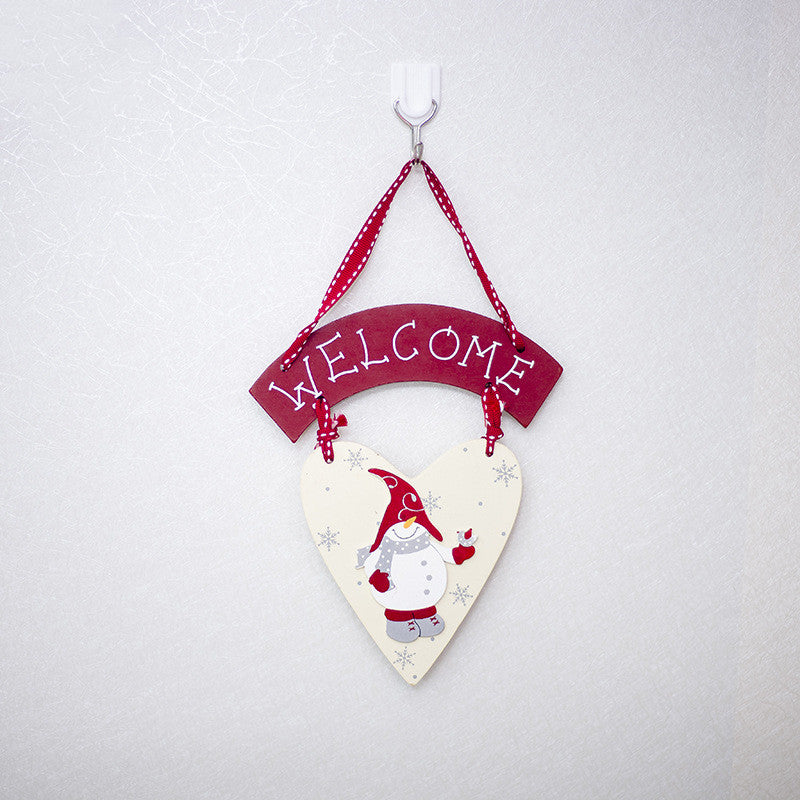 Painted wood Christmas sign weighing 2 ounces, light enough for a small hook
