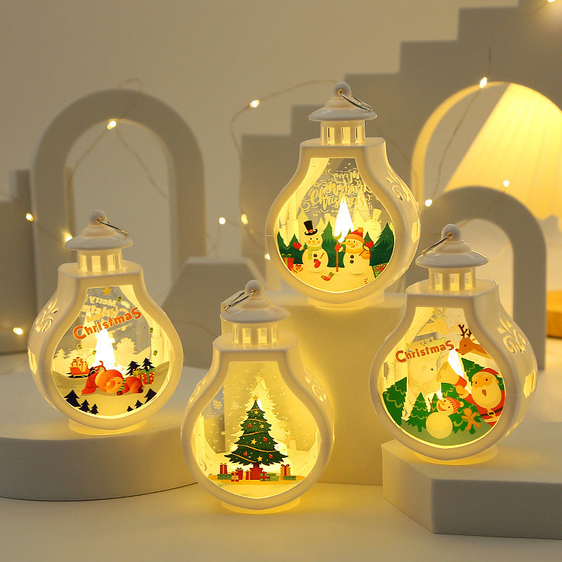 Christmas candle lamp with a glass shell over a molded plastic base