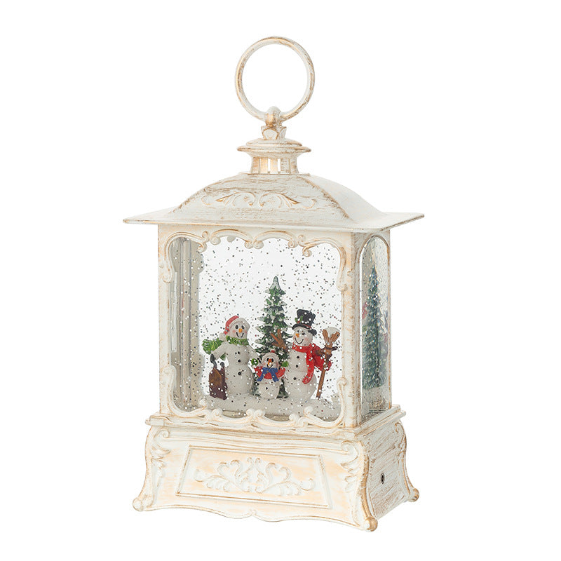 Bronze Santa figure holding up the crystal ball music box