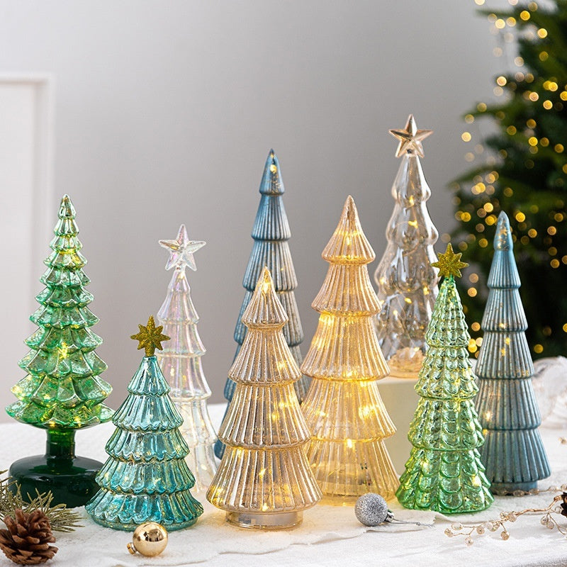 Small green glass Christmas tree ornament cut from clear glass