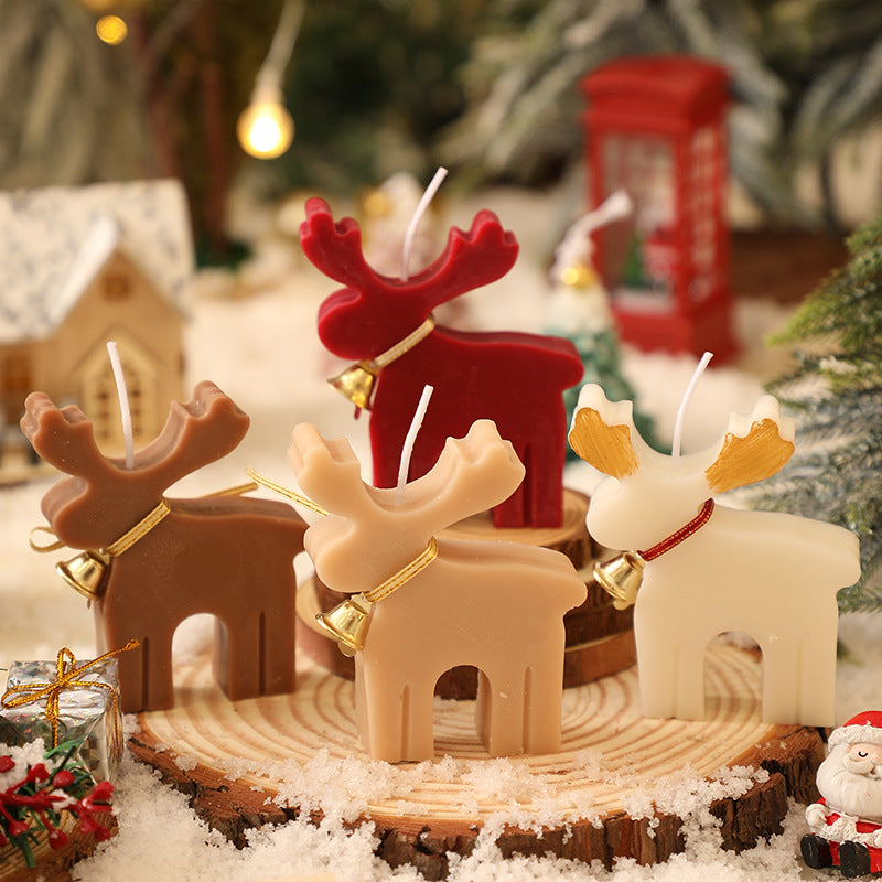 Christmas red soy wax candle molded in the shape of a reindeer