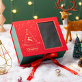 Red Christmas Eve gift box with a fabric and specialty paper outer