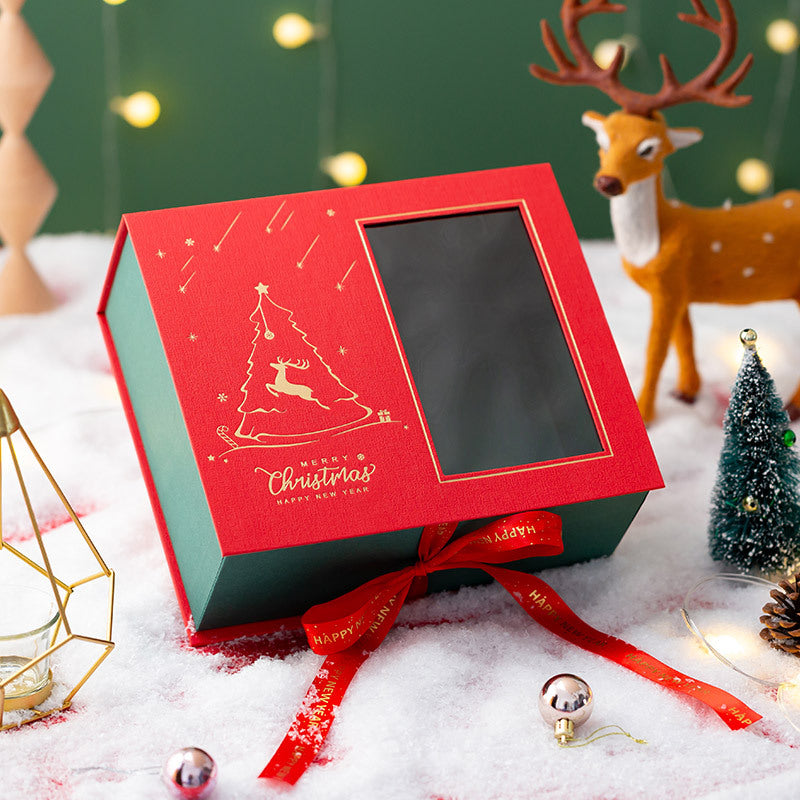 Red Christmas Eve gift box with a fabric and specialty paper outer