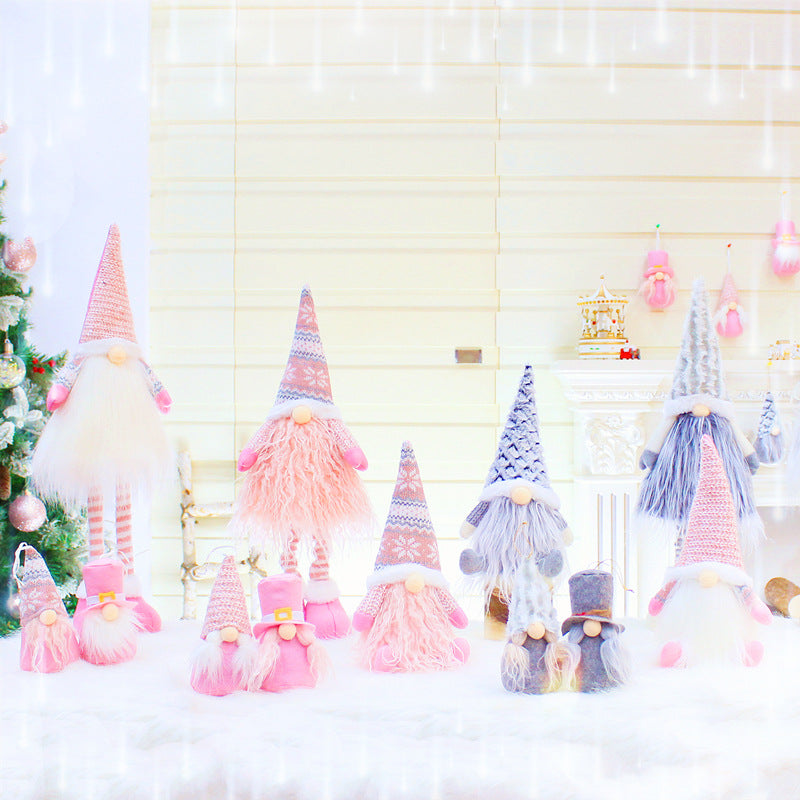 Pink faceless Christmas gnome plush with long extendable legs