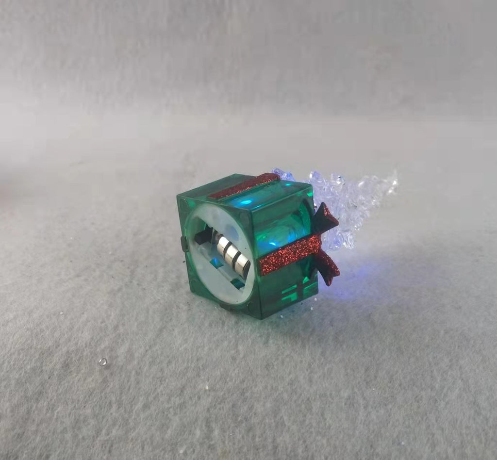 Green molded plastic parcel ornament standing 4.3 inches tall