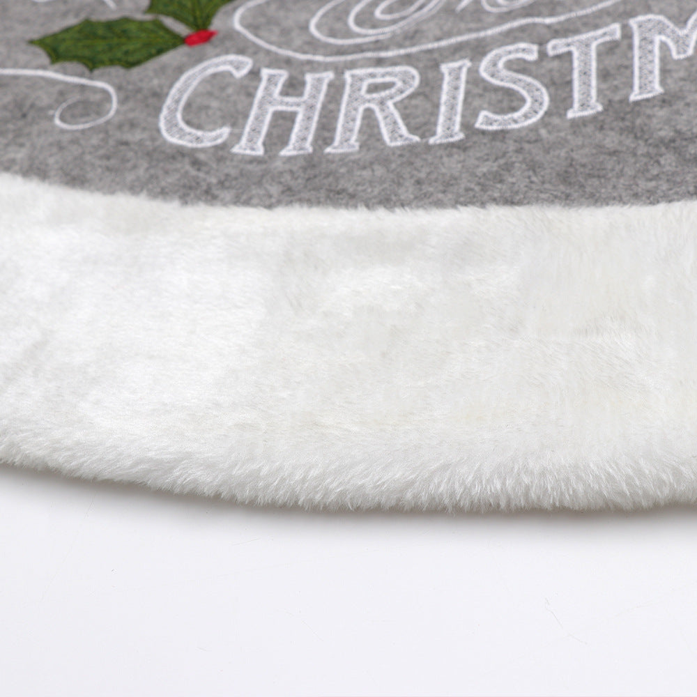 Center opening cut into the round gray tree skirt