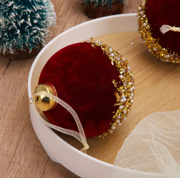 Soft flocked matte surface on the burgundy Christmas ball