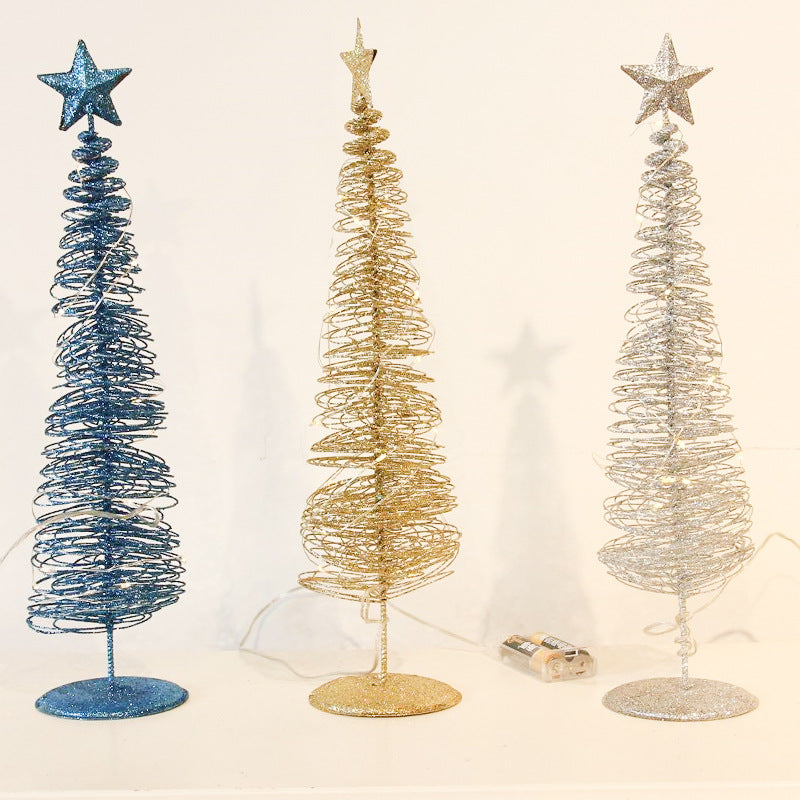 Gold finish wrought iron Christmas tree that emits its own light