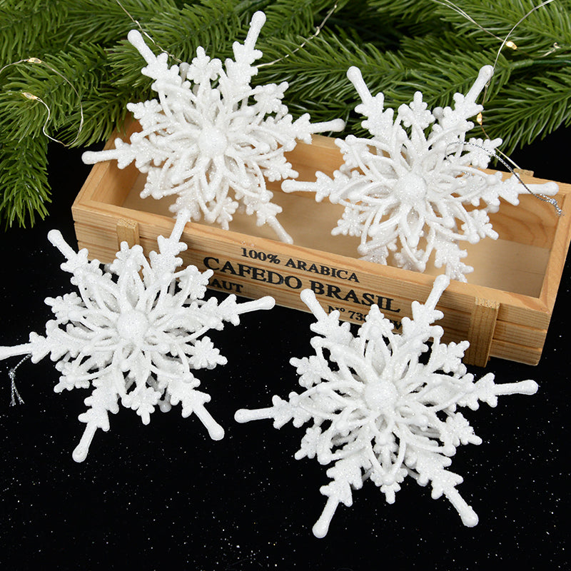 White snowflake Christmas ornament measuring 4.7 inches across