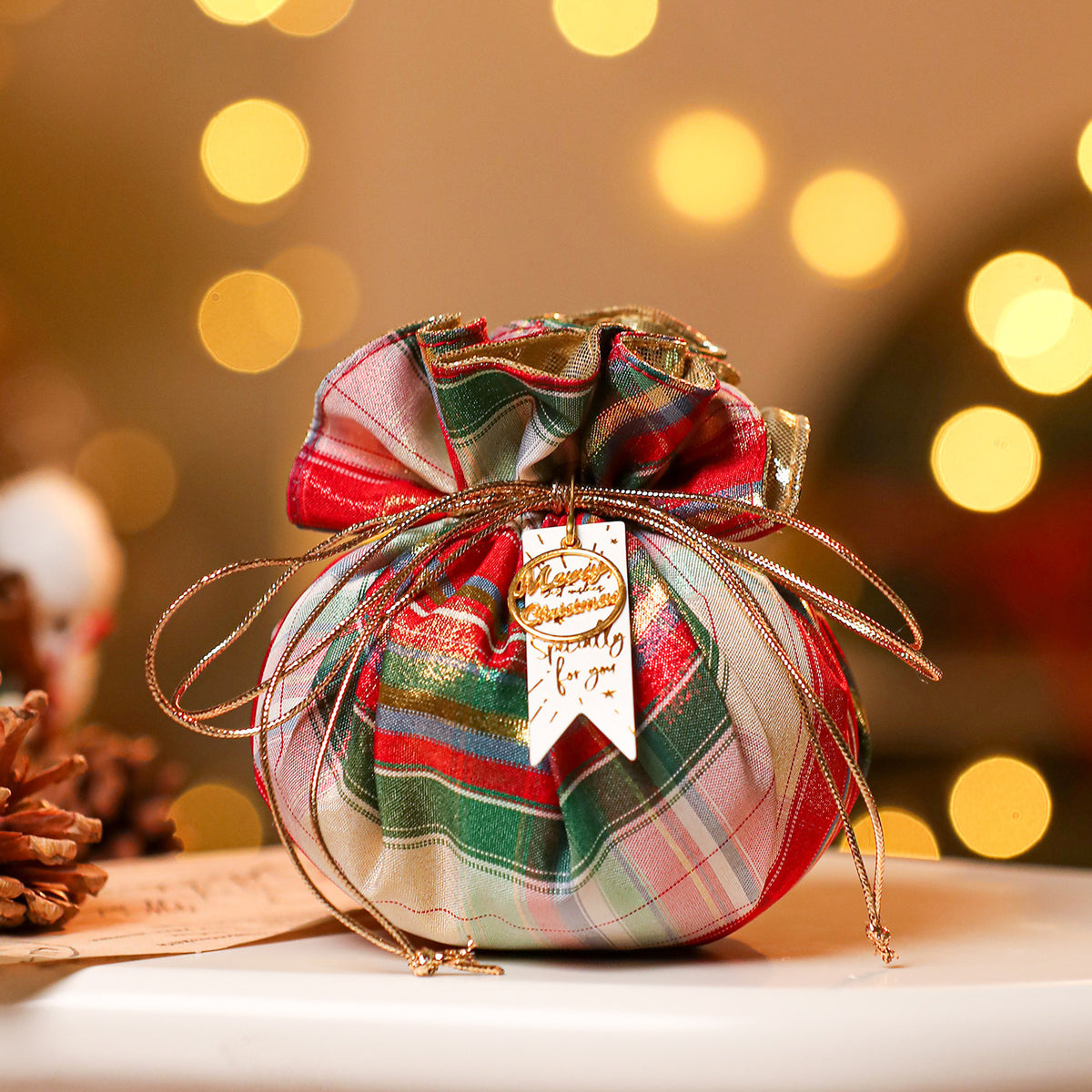 Red fabric Christmas gift pouch sized for jewelry or a gift card