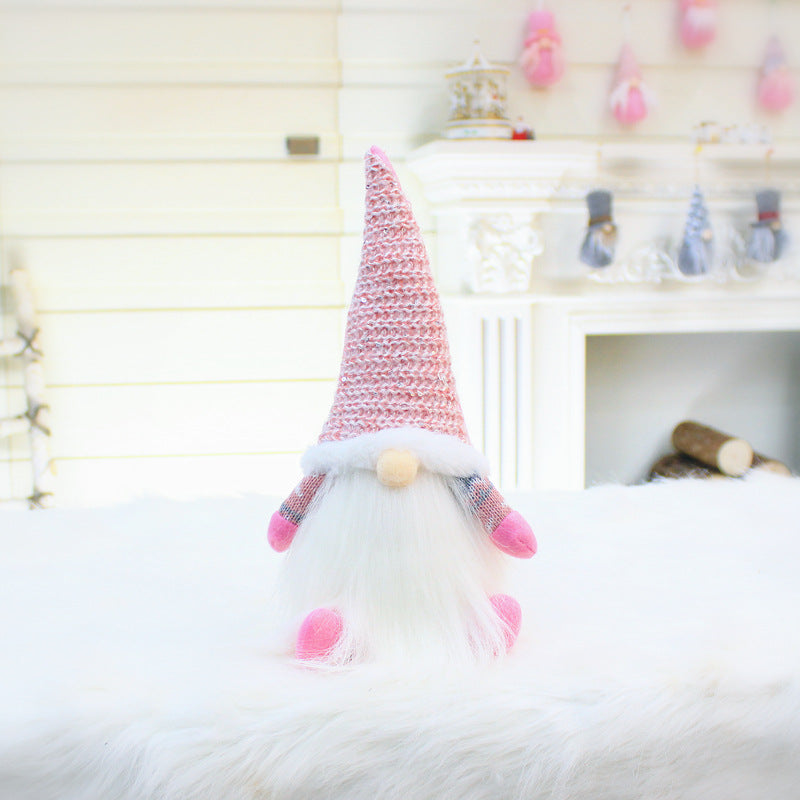 Second gnome design in pink plush with legs hanging forward