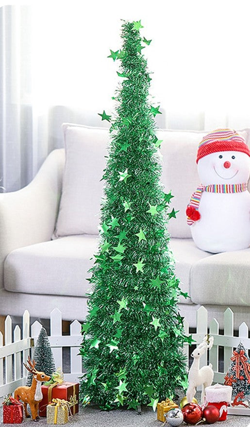 Layered tinsel branch rows on the artificial PVC Christmas tree