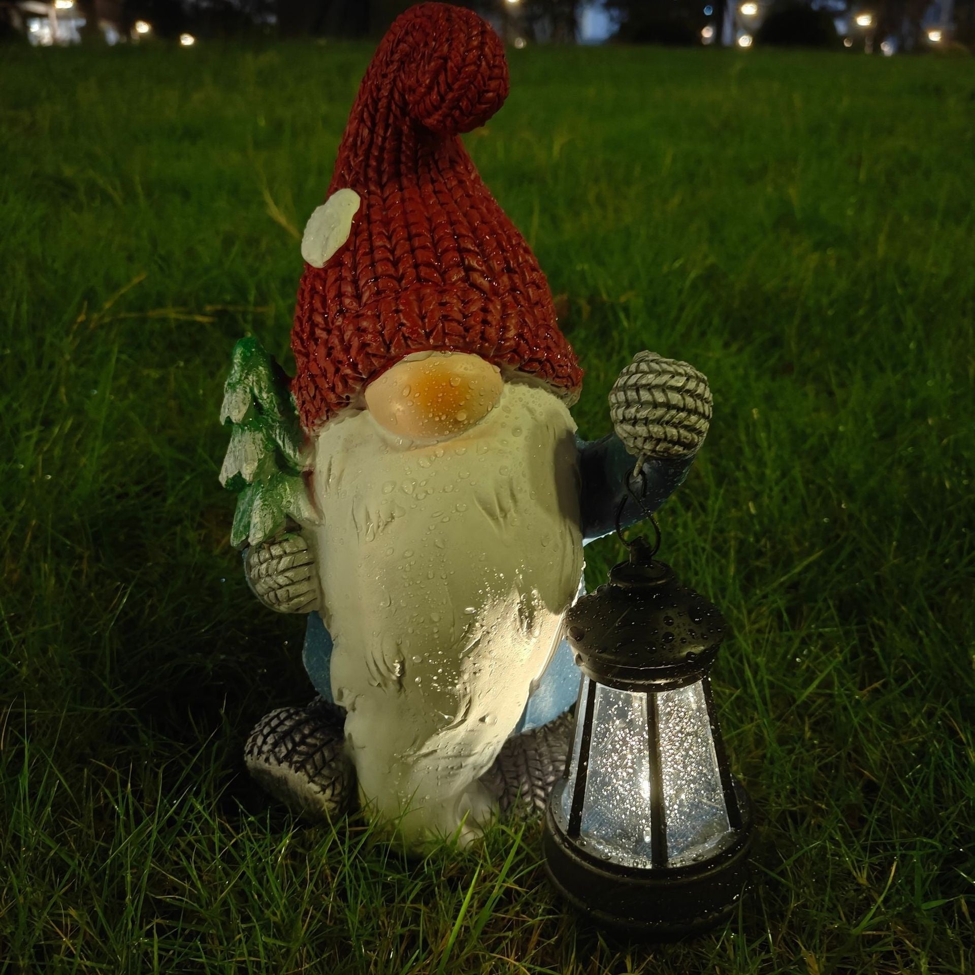 Dwarf elf Christmas figurine in painted resin with a molded coat