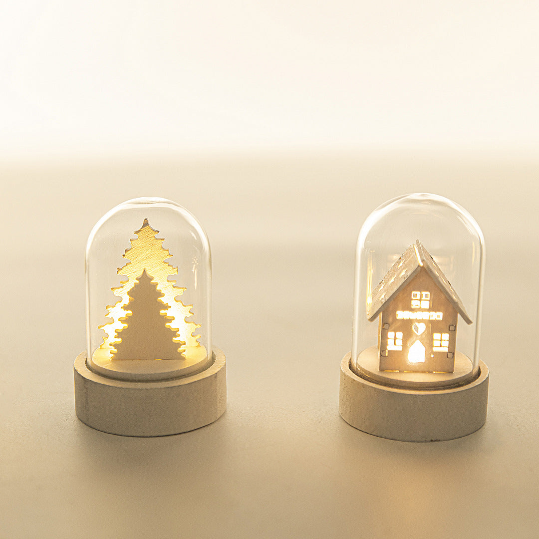 Wooden Christmas village ornament with a luminous glowing finish