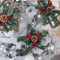 Wooden star Christmas tree ornament trimmed with a small ribbon bow