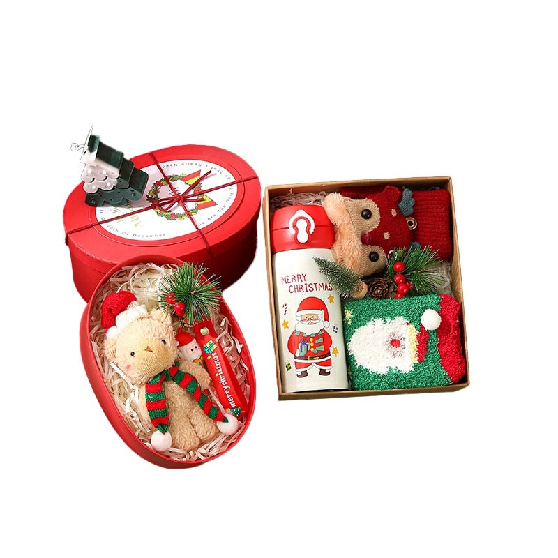Christmas gift box with cartoon holiday artwork across the lid