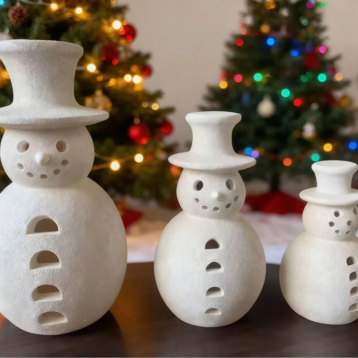 Medium snowman figurine standing 7.9 inches tall with painted hat and scarf