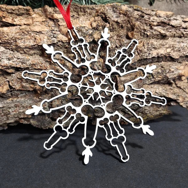 Flat metal snowflake ornament measuring 3.9 by 3.9 inches