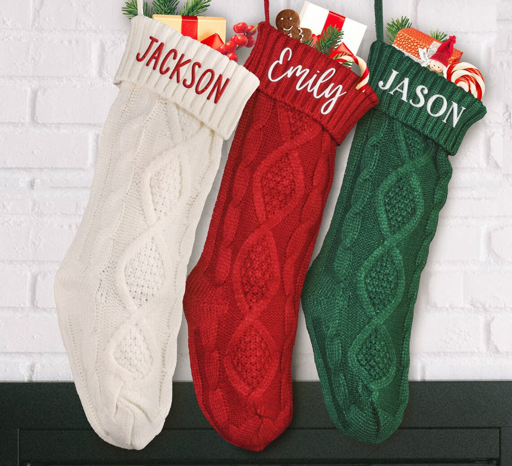 White knitted Christmas stocking with an embroidered turn over cuff