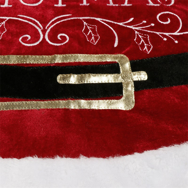 Soft red velvet pile across the cloth tree skirt surface
