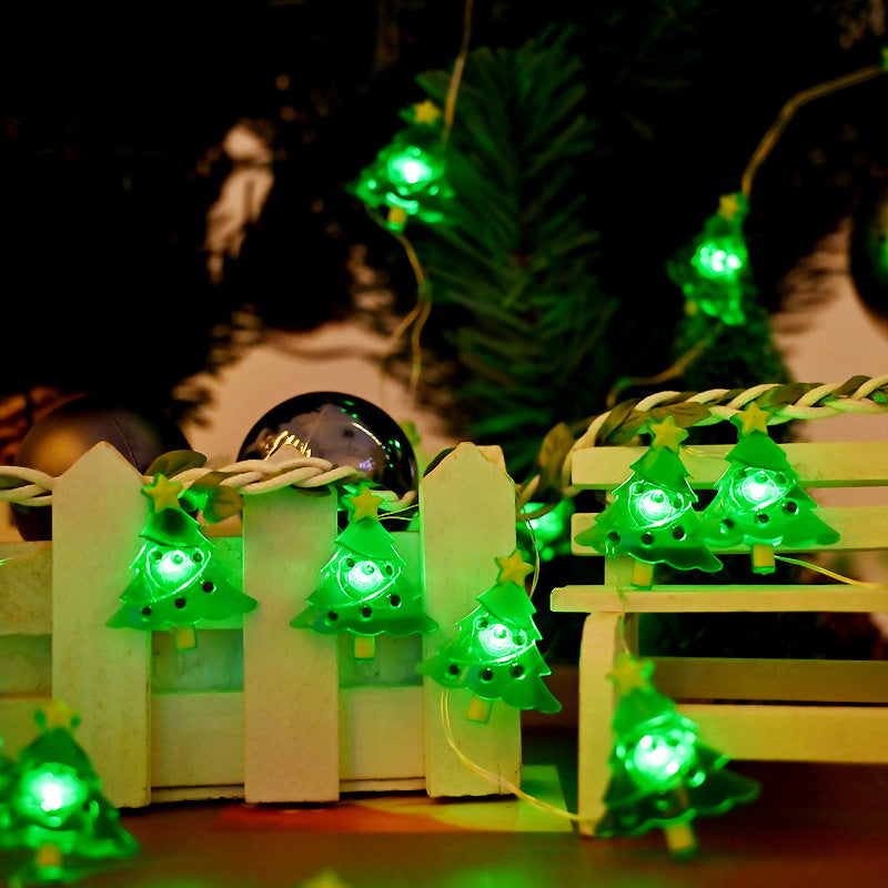 Green Christmas tree shaped lamps along a plastic light chain