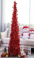 Collapsible Christmas tree folded down with the telescopic center pole retracted