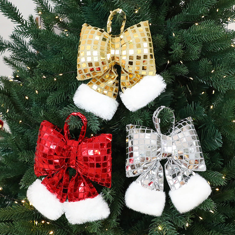 Gold sequin Christmas tree bow made from cloth with a sequin finish