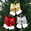 Gold sequin Christmas tree bow made from cloth with a sequin finish