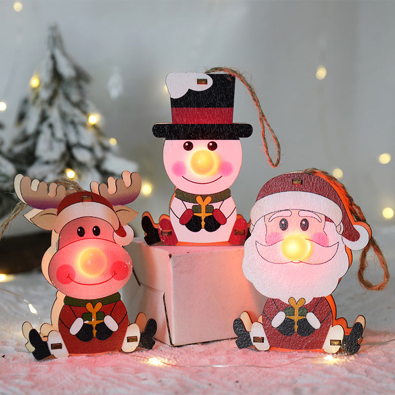 Wooden Christmas tree ornament in the red nose Santa design, sold singly