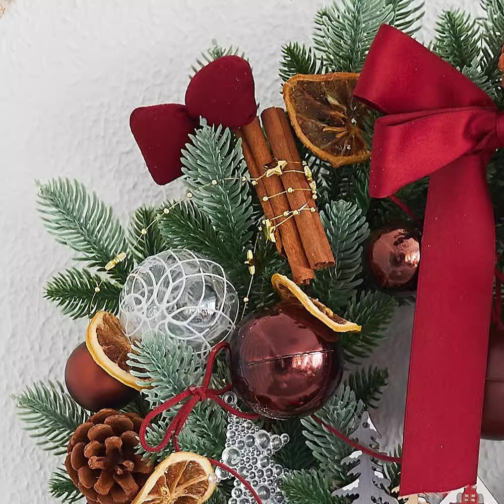 Lit version of the Christmas wreath with small lights among the greenery