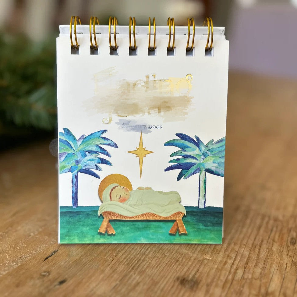Stitched paper pages that open flat through the December countdown
