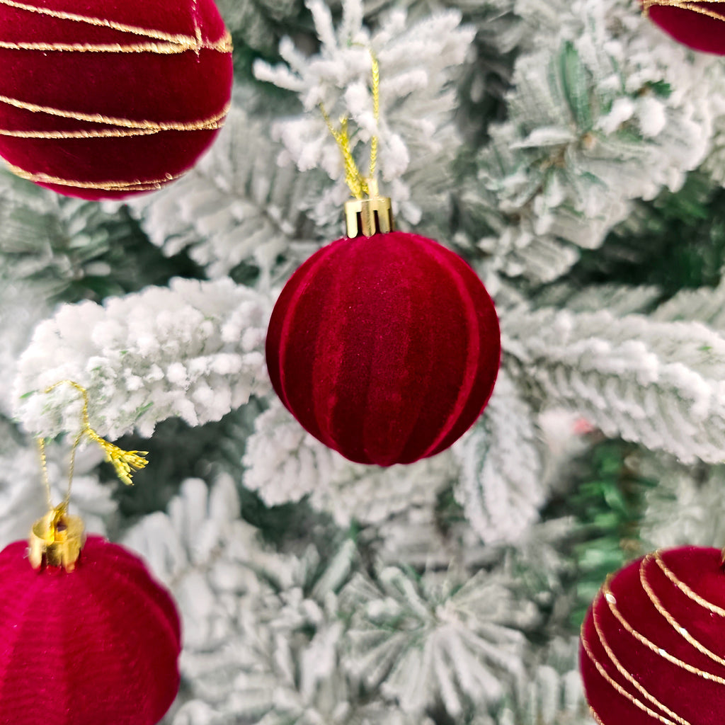 Plastic Christmas baubles with a flocked, painted outer surface