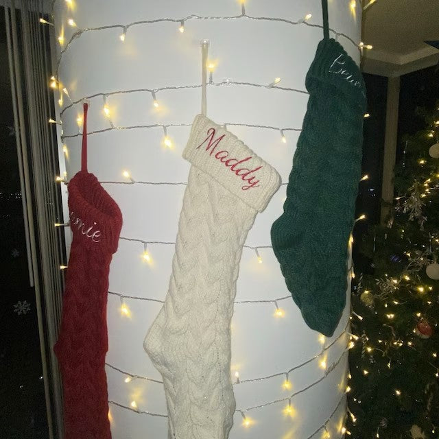 Green knit acrylic Christmas stocking measuring 18.1 inches with the cuff down
