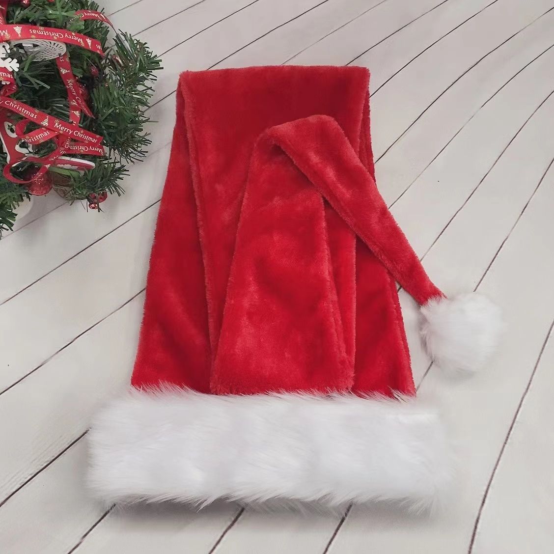 Pink polyester Santa hat with an extra long tail
