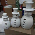 Three graduated snowman ornaments at 5.9, 7.9 and 9.8 inches tall