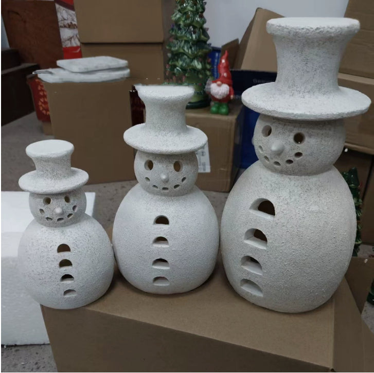 Three graduated snowman ornaments at 5.9, 7.9 and 9.8 inches tall